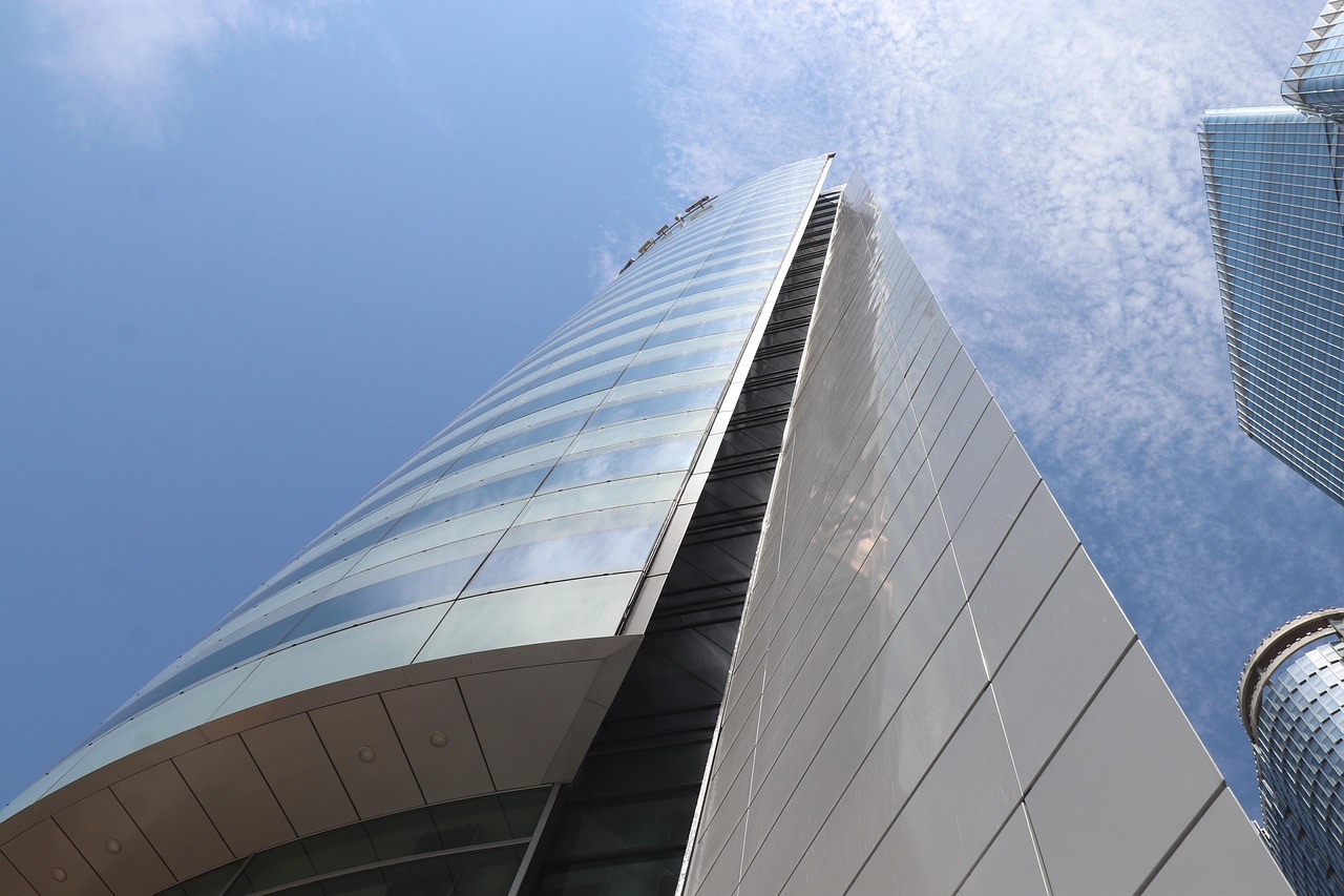 tower, skyscraper, office building, steel, glass, architecture, nature, modern design, real estate, urban, building, city, perspective, sky, facade, clean lines, reflection, futuristic, outside
